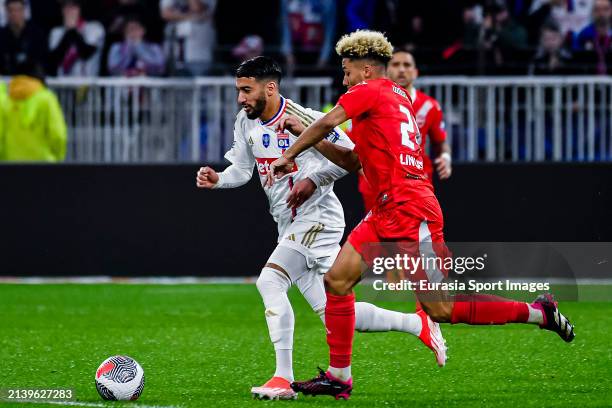 Said Benrahma of Lyon is challenged by Allan Linguet of Valenciennes during French Cup Semi Final match between Olympique Lyon and Valenciennes FC at...