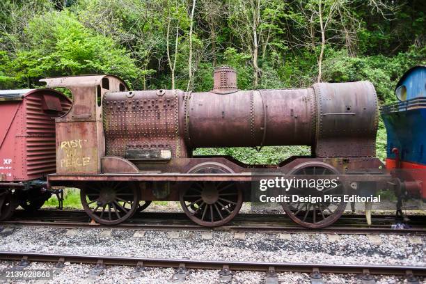 Rust In Peace Graffiti Painted on This Old Steam Engine Located on The Bath To Bristol Cycle Path. Somerset, England.