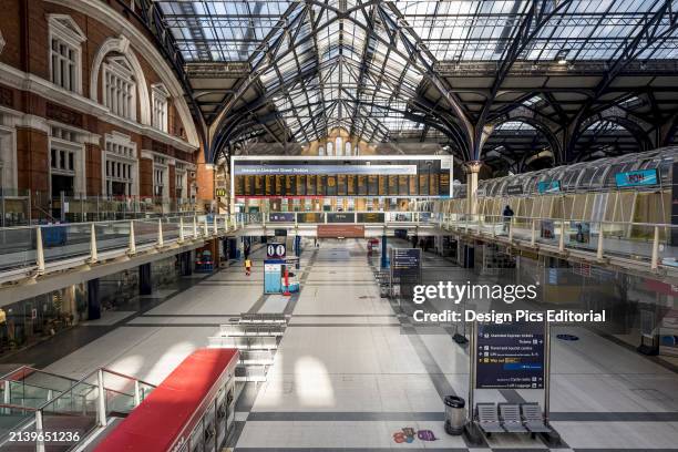 Interior of the Liverpool St Station at morning rush hour during the national lockdown for Covid-19 pandemic; London, England, UK