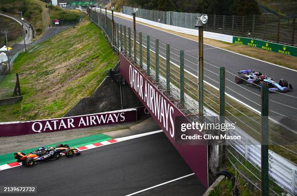 Oscar Piastri of Australia driving the McLaren MCL38 Mercedes and Esteban Ocon of France driving the Alpine F1 A524 Renault on track during practice...