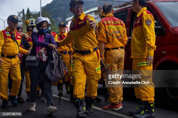 Woman gets out of a rescue van at a temporary rescue command post after being rescued from the Taroko Gorge on April 05, 2024 in Hualien, Taiwan on...
