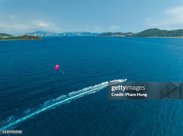 parasailing on nha trang sea - gliding stock pictures, royalty-free photos & images
