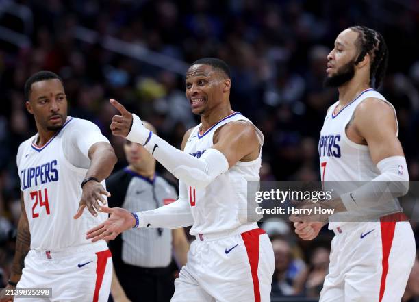 Russell Westbrook of the LA Clippers celebrates his dunk between Norman Powell and Amir Coffey during a 102-100 Clippers win over the Denver Nuggets...