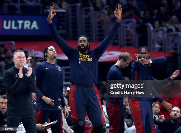 DeAndre Jordan of the Denver Nuggets reacts on the bench with head coach Michael Malone during a 102-100 LA Clippers win at Crypto.com Arena on April...