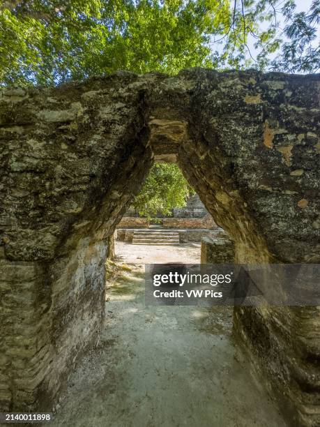 Corbel arch doorway into Plaza E, the royal residence in the Mayan ruins in the Cahal Pech Archeological Reserve, San Ignacio, Belize.