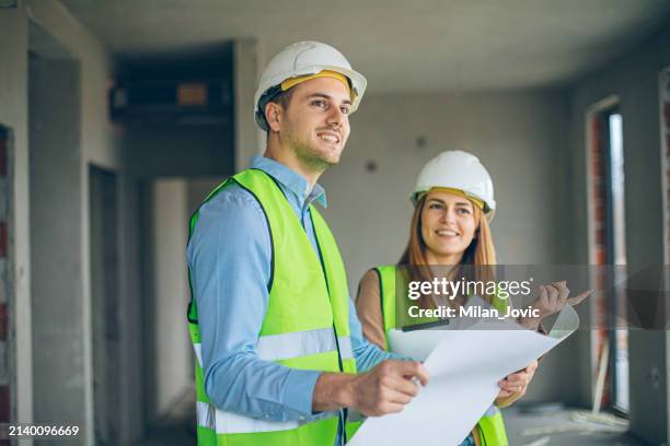 construction engineers working on building site - real estate developer stock pictures, royalty-free photos & images