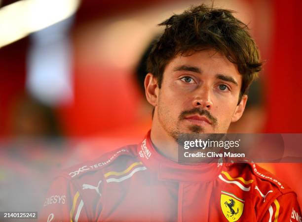 Charles Leclerc of Monaco and Ferrari looks on in the garage during practice ahead of the F1 Grand Prix of Japan at Suzuka International Racing...