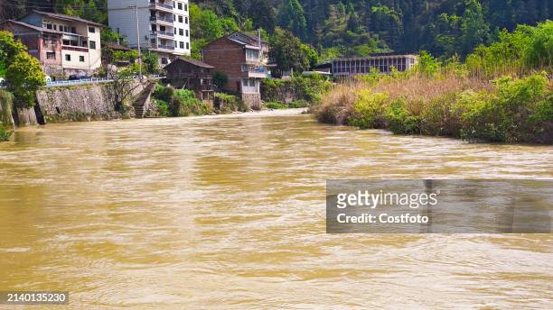 The water level of Liangjiang River rises after heavy rains in Datong Township, Qiandongnan County, Guizhou province, China, April 8, 2024.