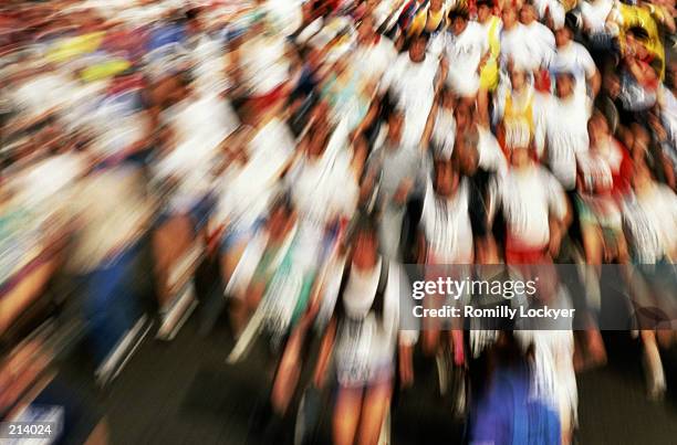 action blur of marathon racers in london - london marathon runners stock pictures, royalty-free photos & images