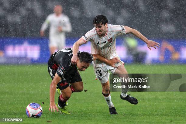 Henry Hore of Brisbane and Aidan Simmons of the Wanderers compete for the ball during the A-League Men round 23 match between Western Sydney...