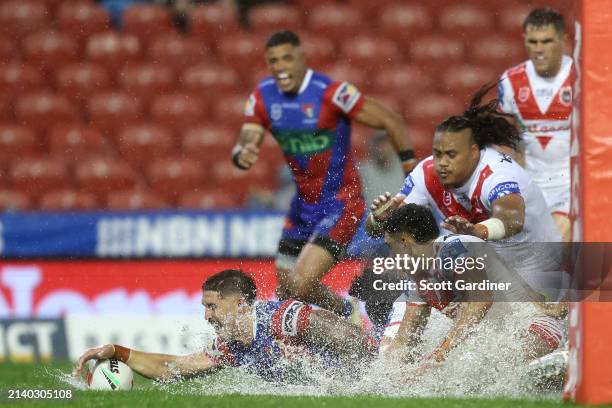 Dylan Lucas of the Knights scores a try during the round five NRL match between Newcastle Knights and St George Illawarra Dragons at McDonald Jones...