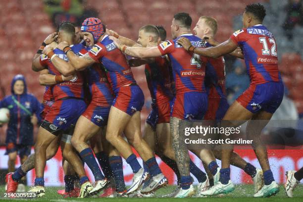 Dylan Lucas of the Knights celebrates with team mates after scoring a try during the round five NRL match between Newcastle Knights and St George...