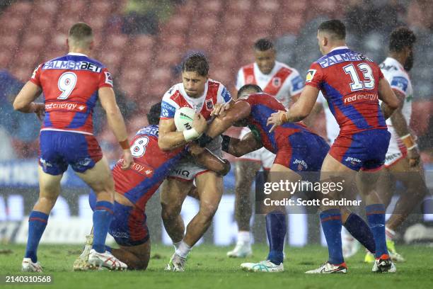 Zac Lomax of the Dragonsis tackled during the round five NRL match between Newcastle Knights and St George Illawarra Dragons at McDonald Jones...