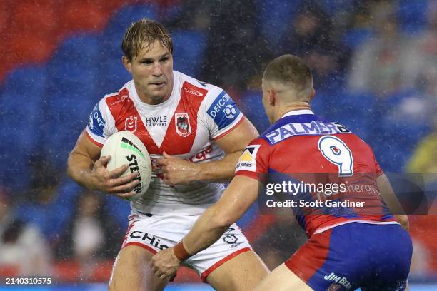 Jack de Belin of the Dragons is tackled during the round five NRL match between Newcastle Knights and St George Illawarra Dragons at McDonald Jones...