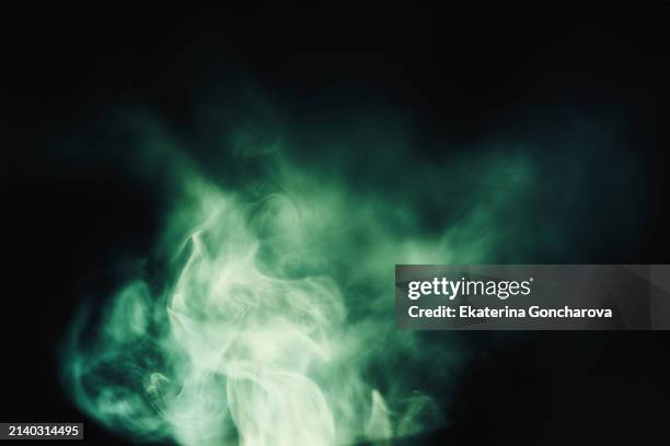 whirling smoke in shades of green - paranormal imagens e fotografias de stock