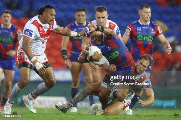 Dane Gagai of the Knights is tackled during the round five NRL match between Newcastle Knights and St George Illawarra Dragons at McDonald Jones...