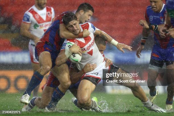 Zac Lomax of the Dragonsis tackled during the round five NRL match between Newcastle Knights and St George Illawarra Dragons at McDonald Jones...