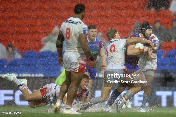 Jackson Hastings of the Knights is tackled during the round five NRL match between Newcastle Knights and St George Illawarra Dragons at McDonald...
