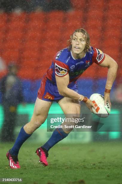 Phoenix Crossland of the Knights passes the ball during the round five NRL match between Newcastle Knights and St George Illawarra Dragons at...