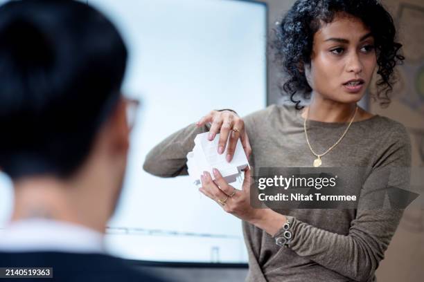 reduced construction time and cost in your project with bim technology. a construction project manager is on discuss with designer about the building design structure to reduce waste and cost during construction phase in an architect's office. - prototype stock pictures, royalty-free photos & images