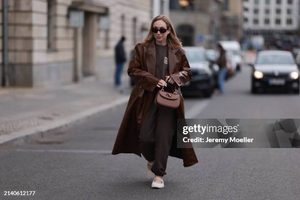 Sonia Lyson seen wearing Celine brown oval Triomphe sunglasses, Sporty & Rich brown cotton oversized logo sweater, matching Sporty & Rich brown...