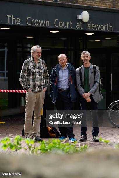 Co-Founder of Just Stop Oil Roger Hallam , Mike Lynch-White and Dr. Larch Maxey pose for photographs outside Isleworth Crown Court ahead of their...