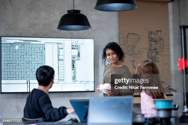 enhances budgeting and cost control with construction project tracking solution. team of a construction designer on a project review meeting of material management to minimize problems during the construction phase. - durability stock pictures, royalty-free photos & images
