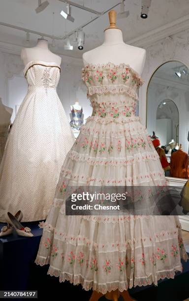 Creation by Christian Dior, Haute Couture collection, Spring-Summer 1955, “Village Festival” cocktail dress in white organdy is displayed during "Un...