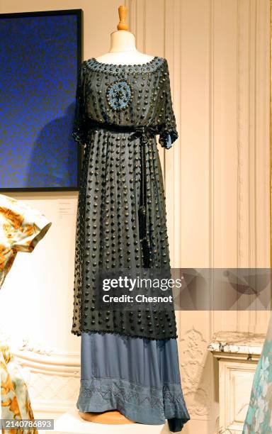Creation by designer Jeanne Lanvin, Haute Couture collection, Winter 1910, long evening dress is displayed during "Un siècle de Haute Couture"...