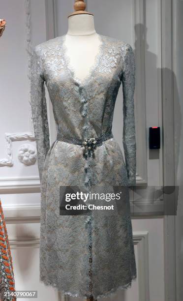 Creation by designer Karl Lagerfeld for CHANEL, Haute Couture collection, Spring-Summer 1996, short evening dress in gray lace is displayed during...