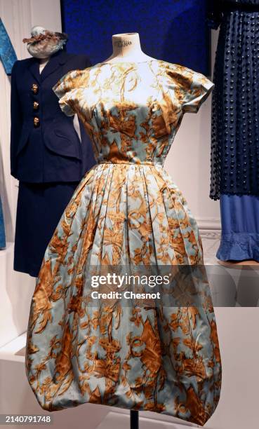 Creation by designer Cristobal Balenciaga, Haute Couture collection, Fall-Winter 1957, silk dress in printed silk satin, sky blue and gold is...