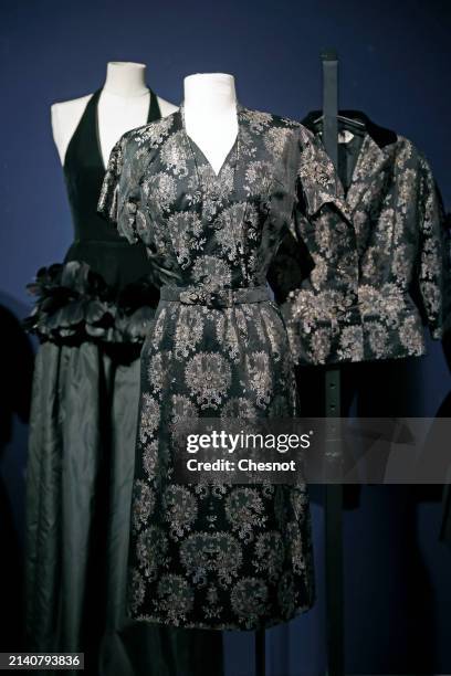 Creation by designer Christian Dior, Haute Couture collection, circa 1952, cocktail set in black silk brocade is displayed during "Un siècle de Haute...