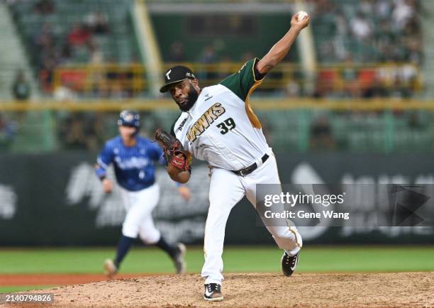 Reymin Guduan of TSG Hawks pitches in the top of the nineth inning during the CPBL game between Fubon Guardians and TSG Hawks at Chengching Lake...