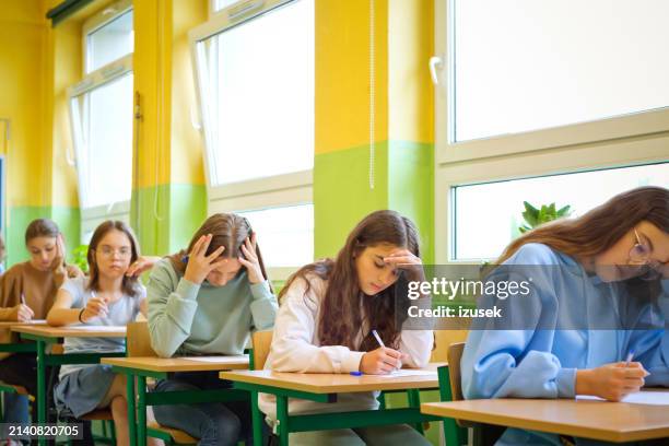 female high school students during exam - examen bildbanksfoton och bilder