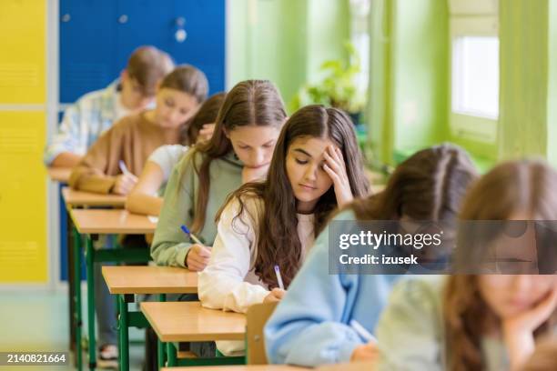 female high school students during exam - midterm exam stock pictures, royalty-free photos & images