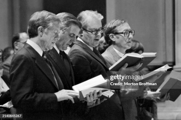 President Jimmy Carter attends an inter-faith prayer service for the Americans held hostage in Iran on November 15, 1979. With Carter are...