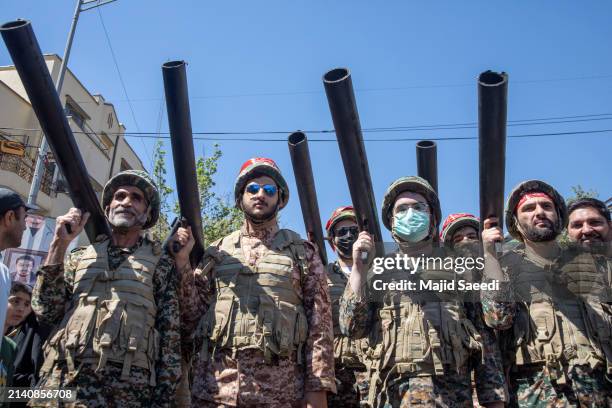 Iranians attend the funeral of seven Revolutionary Guard Corps members killed in a strike on the country's consular annex in Damascus, which Tehran...