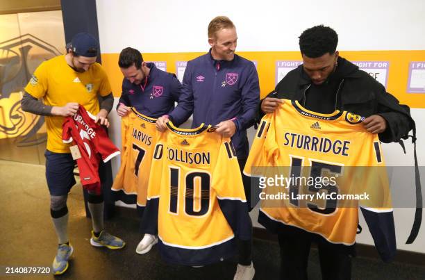Premier League players Matt Jarvis, Jack Collison and Daniel Sturrridge exchange and sign jerseys with Filip Forsberg of the Nashville Predators...