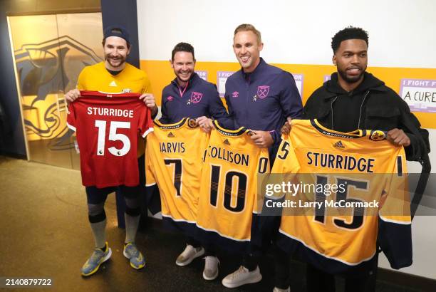 Premier League players Matt Jarvis, Jack Collison and Daniel Sturrridge exchange and sign jerseys with Filip Forsberg of the Nashville Predators...