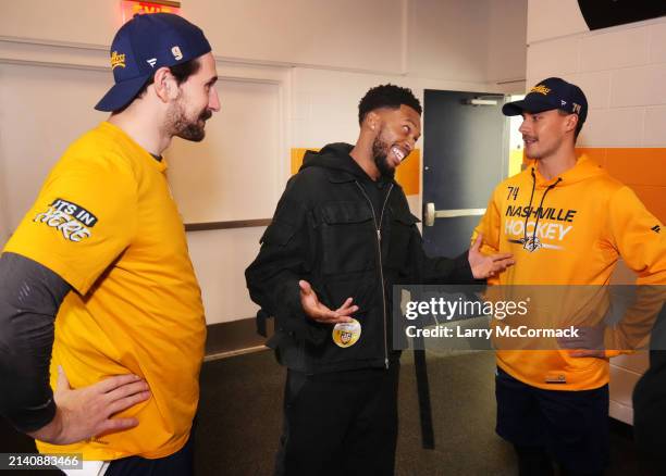 Premier League players Matt Jarvis, Jack Collison and Daniel Sturrridge practice their stick work before the Nashville Predators game at Bridgestone...