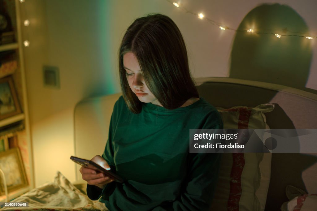 Portrait of a person with mobile phone in hand