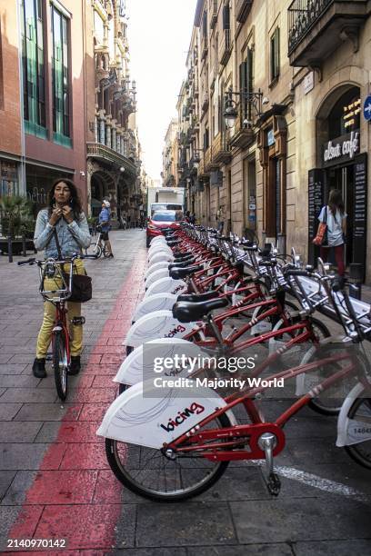 City street with bicycles to hire. Barcelona, Spain.