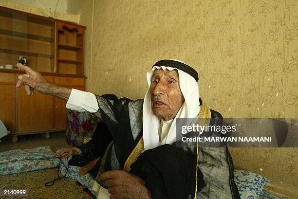 Hamid father of Abid Hamid Mahmud, the most trusted lieutenant of toppled leader Saddam Hussein, describes 19 June 2003, at his home in the town of...
