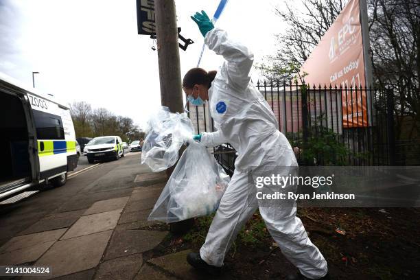 Forensic officer leaves the scene on April 05, 2024 in Salford, England. A murder investigation has been launched after unidentified human remains...