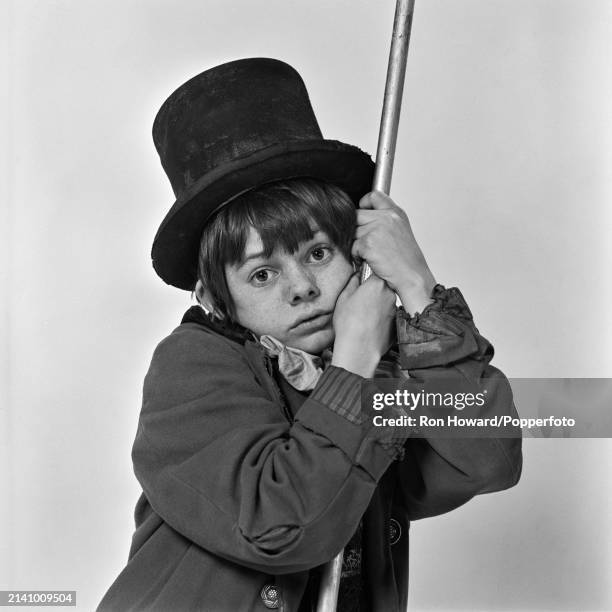 English actor and singer Jack Wild dressed in character as the Artful Dodger as played in the film version of Lionel Bart's stage musical Oliver!, in...