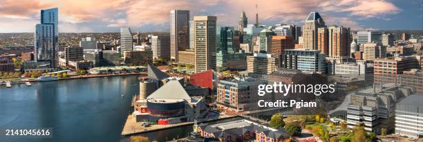 baltimore maryland downtown panorama city skyline and inner harbour by the patapsco river - federal hill stock pictures, royalty-free photos & images