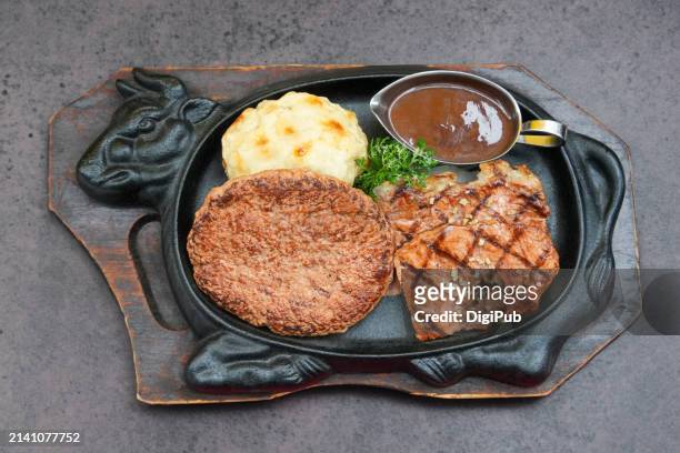 savory beef teishoku meal on cast iron plate - chuo ward tokyo stock pictures, royalty-free photos & images