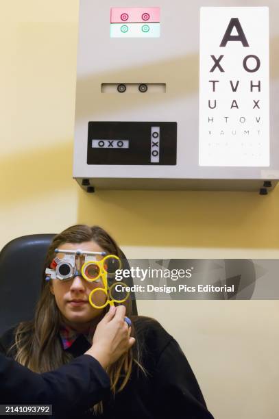 United Kingdom, England, Child myopic optician; Esher.