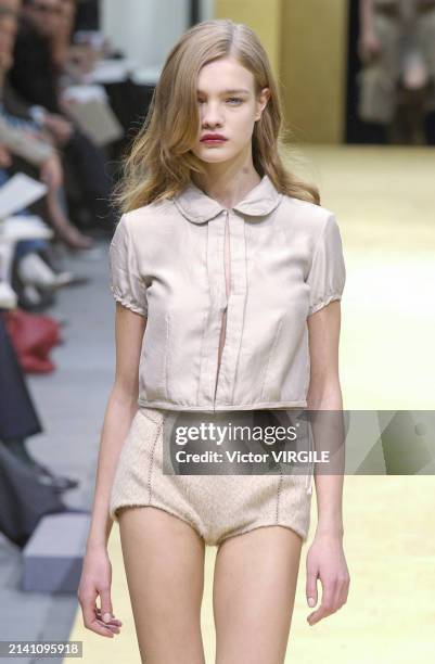 Natalia Vodianova walks the runway during the Louis Vuitton Ready to Wear Fall/Winter 2002-2003 fashion show as part of the Paris Fashion Week on...