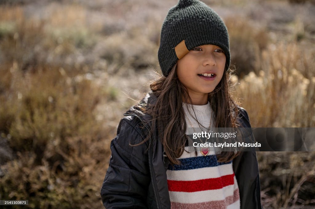 Cute 8 Years Girl In Knit Hat Outdoors in Winter